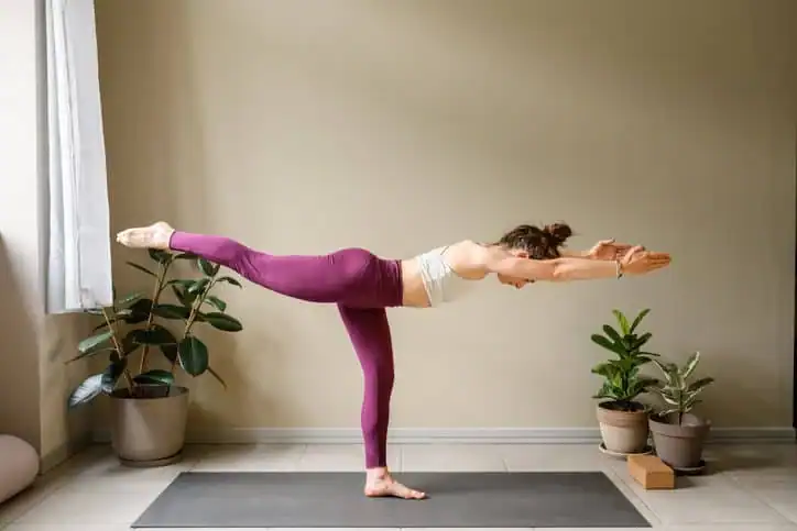Achieving the Perfect Tone: How Often Should You Exercise for Results? 1 Woman doing Yoga exercise Wilmslow to help with toning the body.