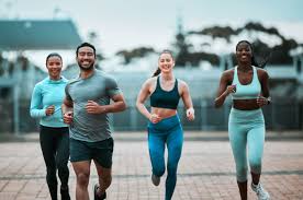 Sculpting Sleek Arms: The Essential Role of Cardio in Toning Without Bulking Up 3 image of people running to incorporate cardio Wilmslow exercise into their life to help tone arms and body.