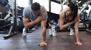 Sculpting Sleek Arms: The Essential Role of Cardio in Toning Without Bulking Up 1 Image of man and woman doing Cardio Wilmslow to tone their arms.